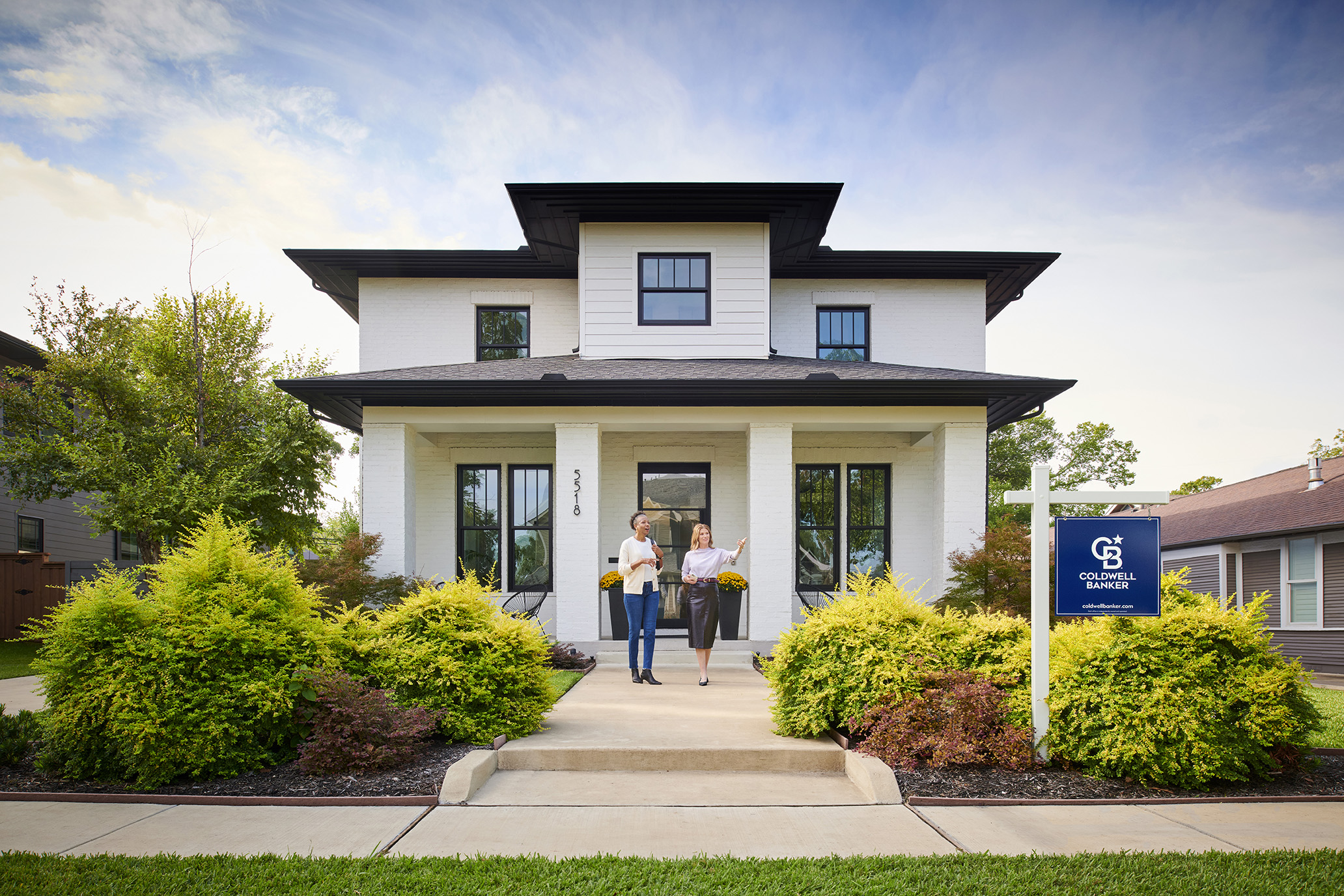 people in front of house